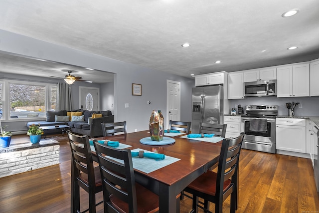 dining space with dark wood-style floors, recessed lighting, and a ceiling fan