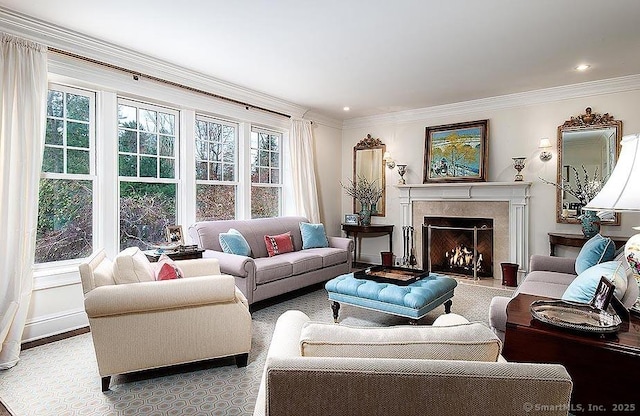 living room with ornamental molding, a fireplace, and recessed lighting