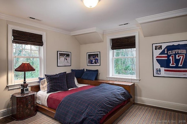 bedroom featuring ornamental molding and visible vents