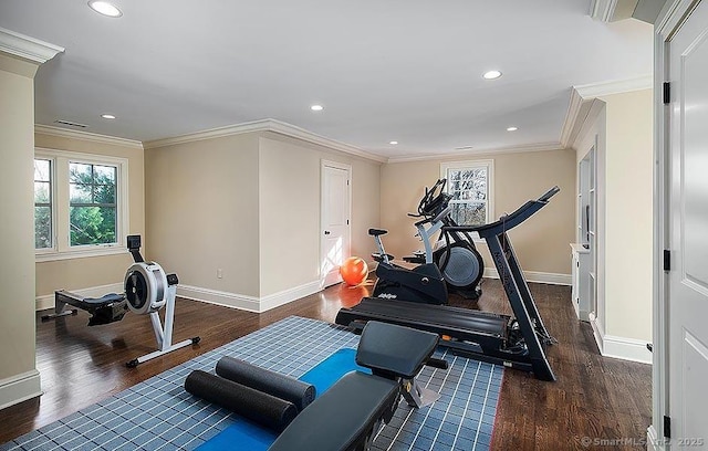 workout area with dark wood-style floors, recessed lighting, crown molding, and baseboards