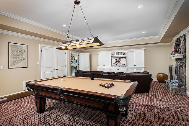 playroom with carpet floors, a large fireplace, baseboards, and ornamental molding