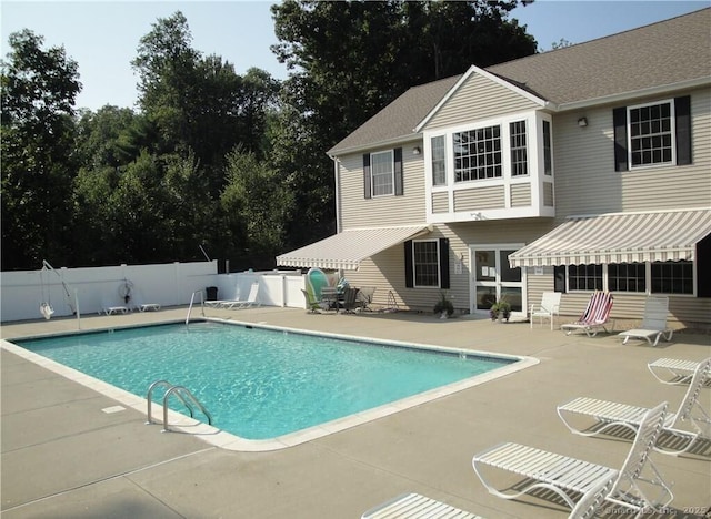 view of swimming pool with a patio area, a fenced backyard, and a fenced in pool