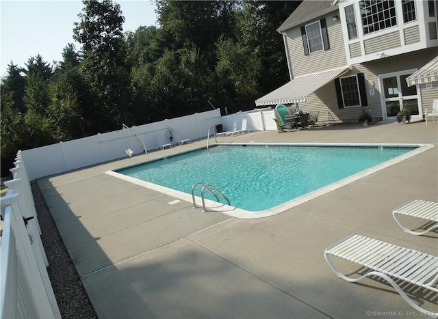 view of swimming pool featuring a fenced in pool, a patio area, and a fenced backyard