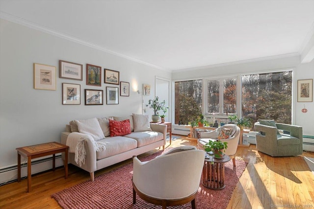 living room with a baseboard radiator, ornamental molding, and wood finished floors