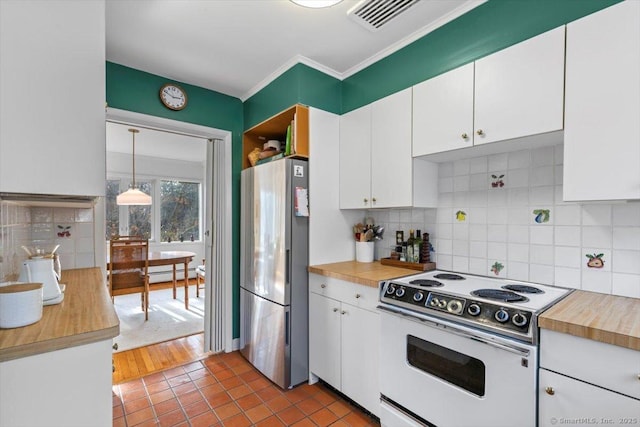 kitchen with white range with electric stovetop, white cabinets, decorative light fixtures, freestanding refrigerator, and baseboard heating