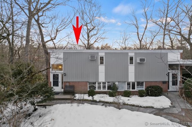 view of front of home with brick siding