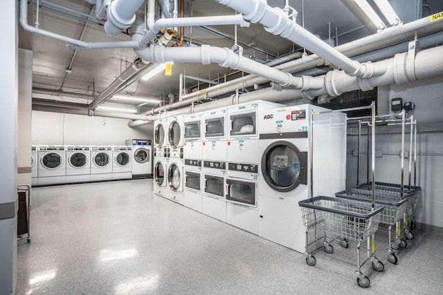 community laundry room featuring washer and clothes dryer and stacked washer and clothes dryer