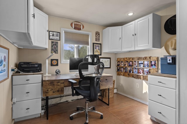 office featuring light wood-type flooring and baseboards