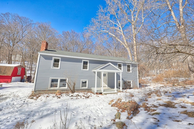 split foyer home featuring a chimney