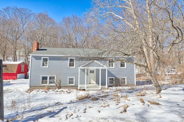 view of front of property featuring a chimney