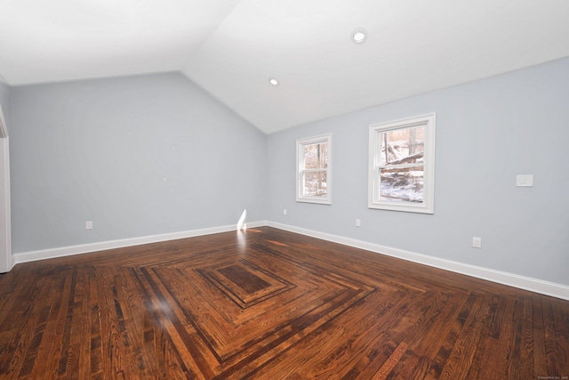 interior space with lofted ceiling and baseboards