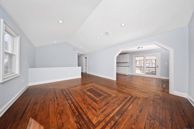 additional living space with lofted ceiling, baseboards, dark wood finished floors, and recessed lighting