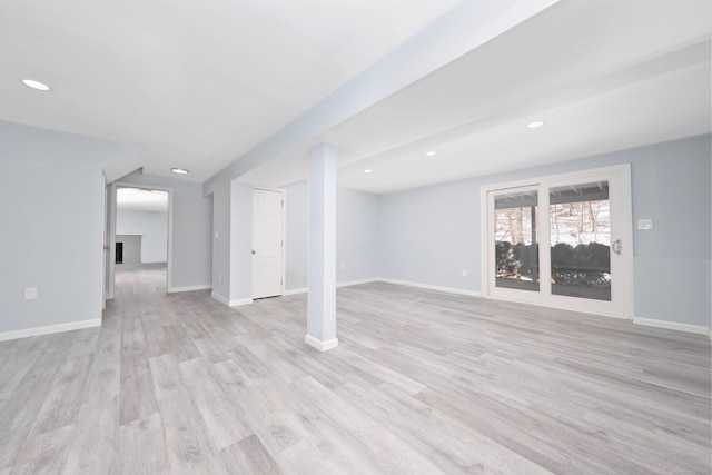 basement with light wood finished floors, recessed lighting, and baseboards