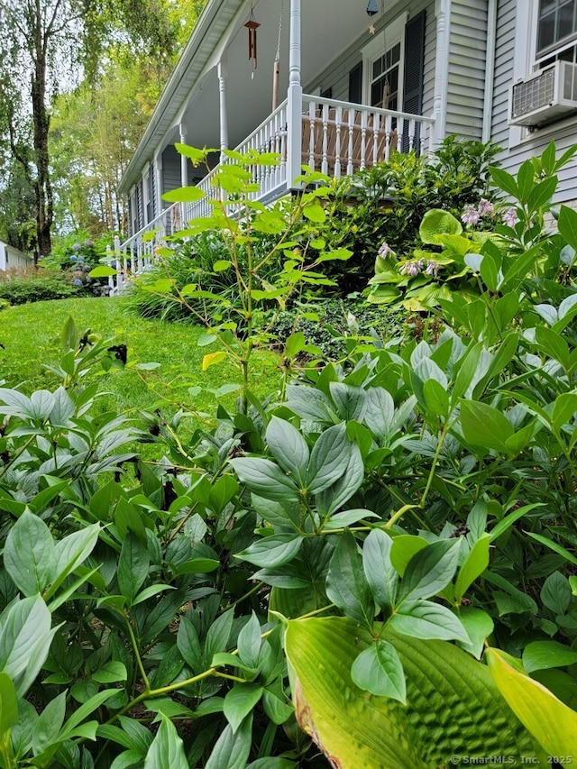 view of side of property with cooling unit