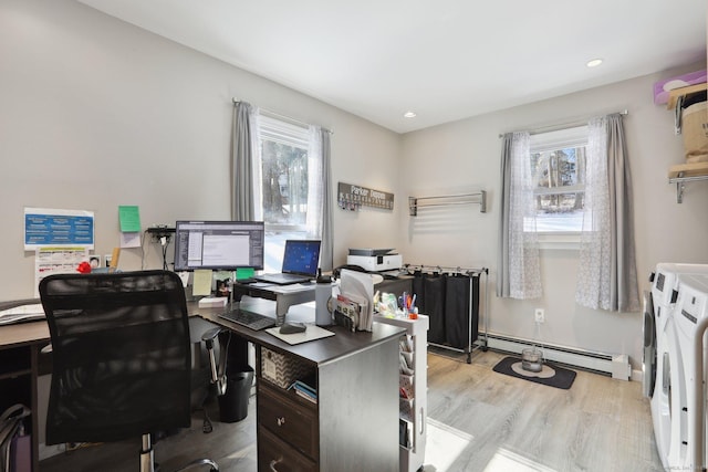 office area with a baseboard heating unit, washer and dryer, light wood finished floors, and recessed lighting