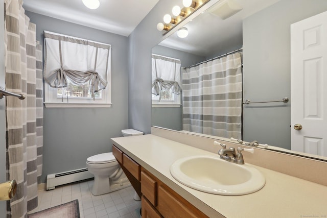 full bath featuring a baseboard radiator, vanity, toilet, and a healthy amount of sunlight