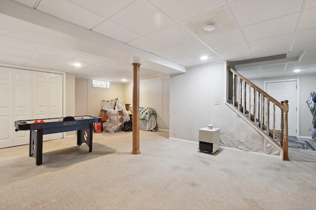 recreation room featuring carpet floors, a paneled ceiling, baseboards, and recessed lighting