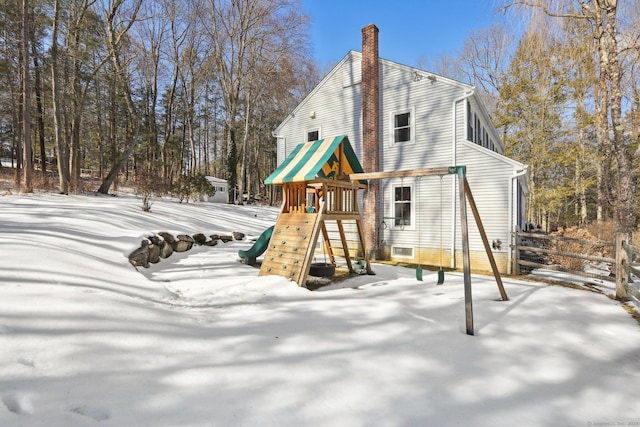 snow covered playground with a playground