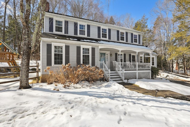 view of front of home featuring covered porch and a chimney