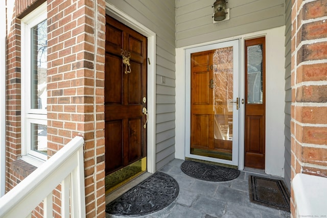 entrance to property with brick siding