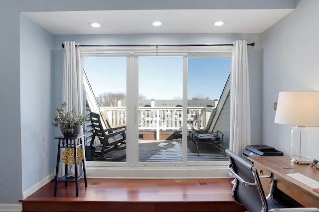 interior space with recessed lighting, wood finished floors, visible vents, and baseboards