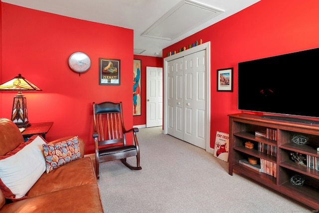 interior space featuring carpet flooring and attic access