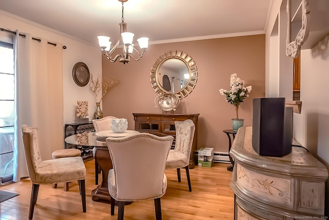 dining area with light wood-style floors, a baseboard heating unit, a notable chandelier, and ornamental molding