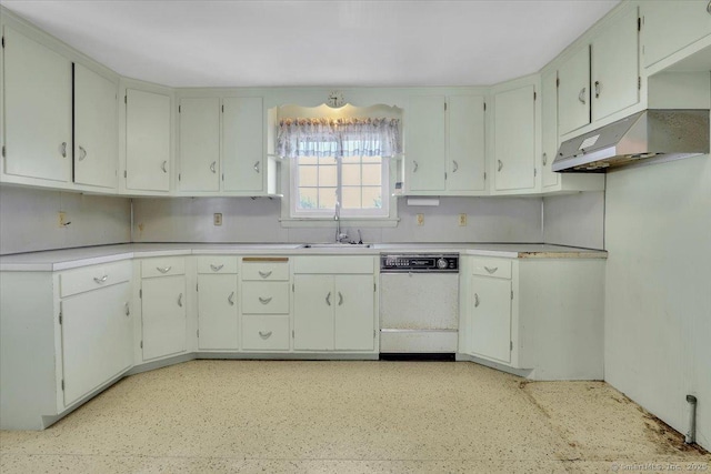 kitchen featuring white cabinets, light countertops, and dishwasher