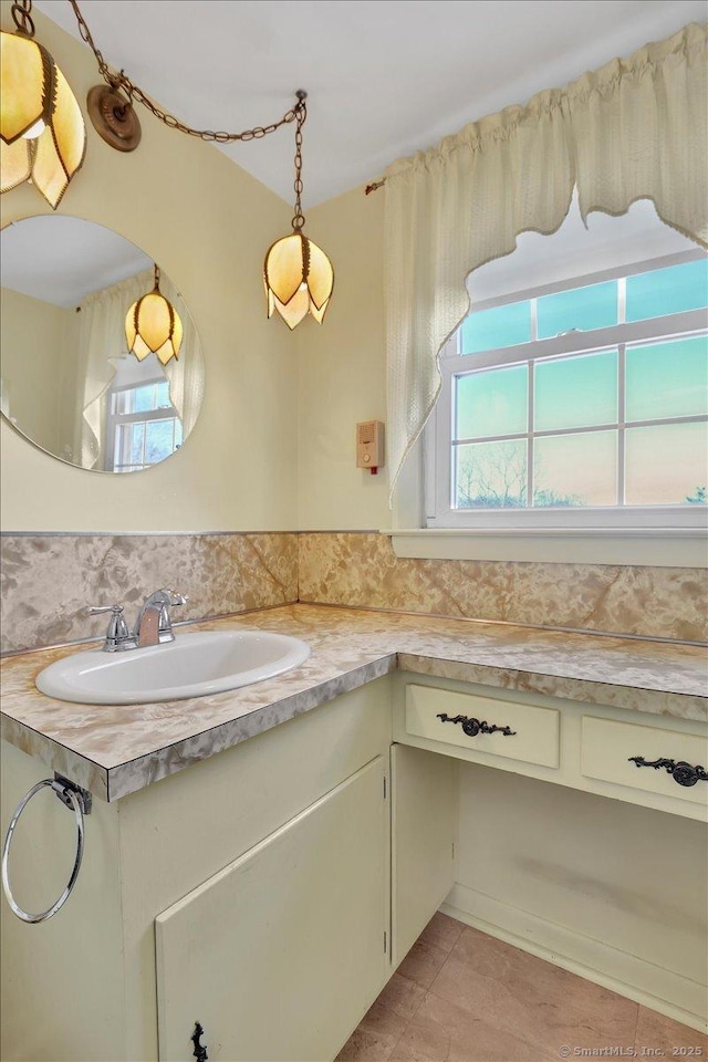 bathroom with tile patterned flooring and vanity