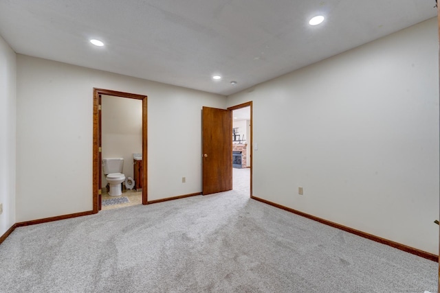 carpeted spare room with recessed lighting and baseboards