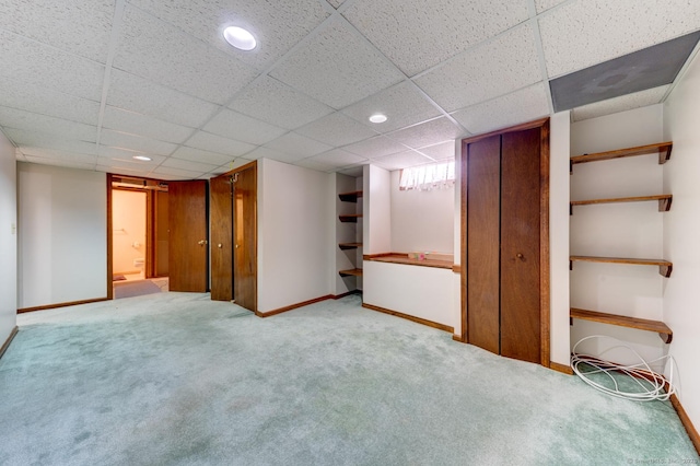 finished below grade area with recessed lighting, light colored carpet, and baseboards