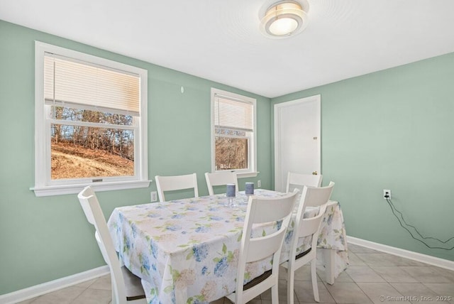 tiled dining space with baseboards