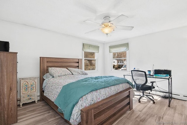 bedroom with ceiling fan and wood finished floors