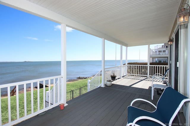 wooden deck with a water view