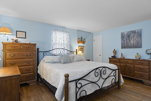 bedroom featuring dark wood-style flooring