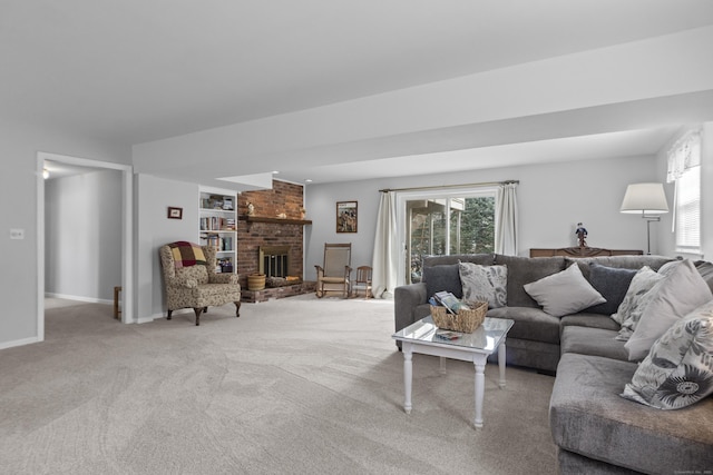 living area with built in shelves, carpet, a fireplace, and baseboards