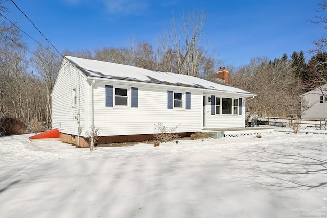 view of front of property with a chimney