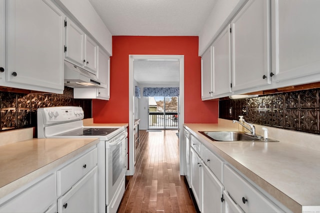 kitchen with light countertops, white cabinets, white electric range, and under cabinet range hood