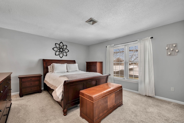 bedroom featuring light colored carpet, visible vents, and baseboards