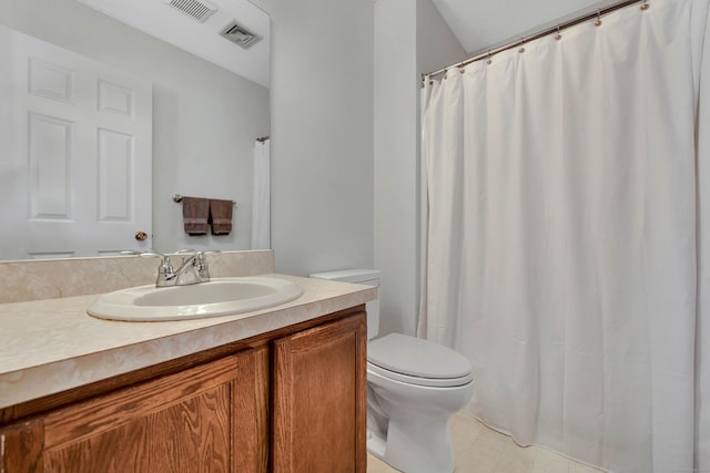 bathroom with toilet, visible vents, and vanity