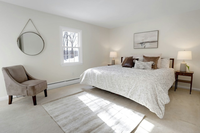 bedroom featuring a baseboard heating unit, light carpet, and baseboards