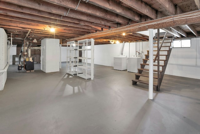 basement featuring washer and dryer and stairway