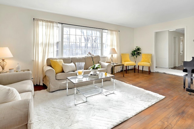 living room with wood finished floors and baseboards