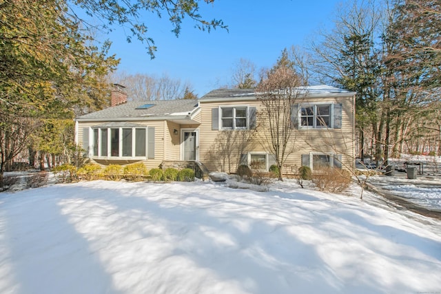 tri-level home with a chimney