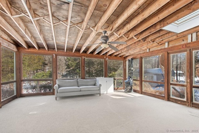 unfurnished sunroom with a skylight and ceiling fan