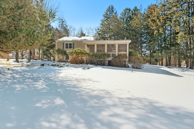 view of front of home with a sunroom