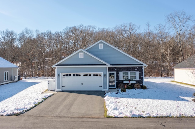 view of front of house with aphalt driveway and an attached garage