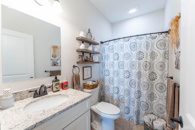 bathroom featuring toilet, curtained shower, tile patterned flooring, and vanity