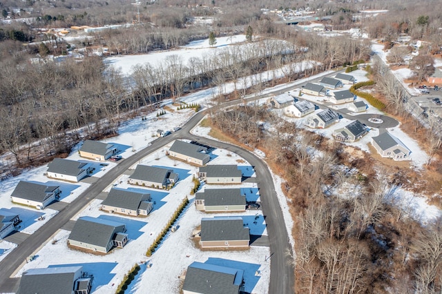 snowy aerial view featuring a residential view