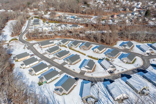 snowy aerial view featuring a residential view